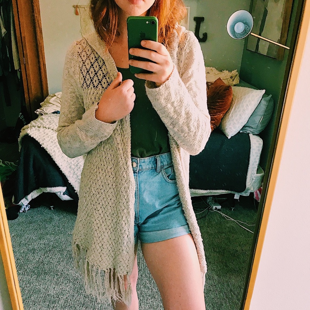 cream sweater with tassels